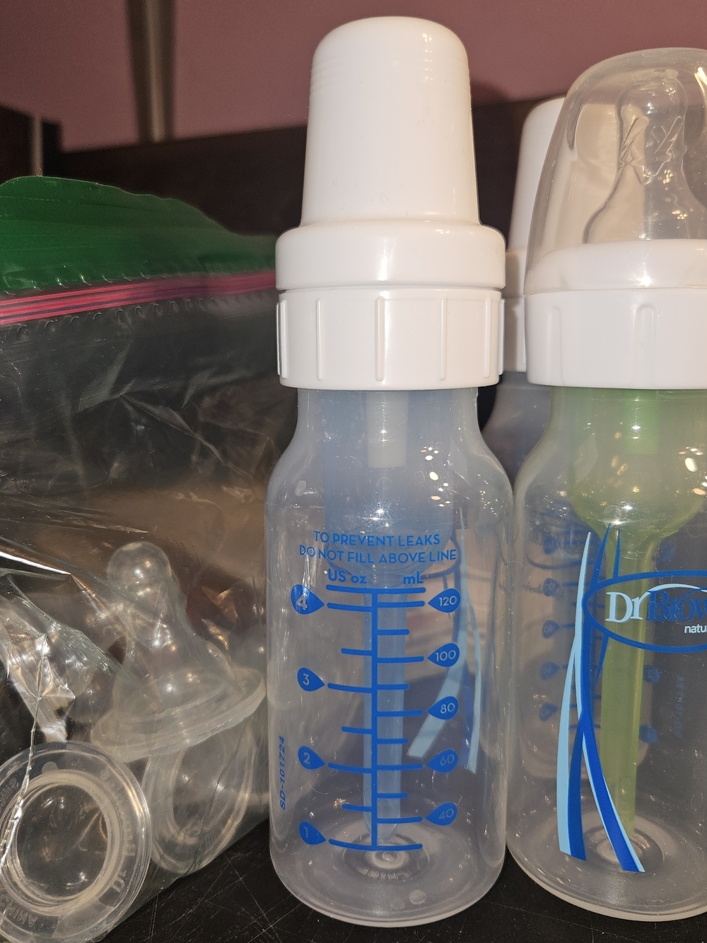 Clear Baby Feeding Bottle with White Cap and Blue Markings -